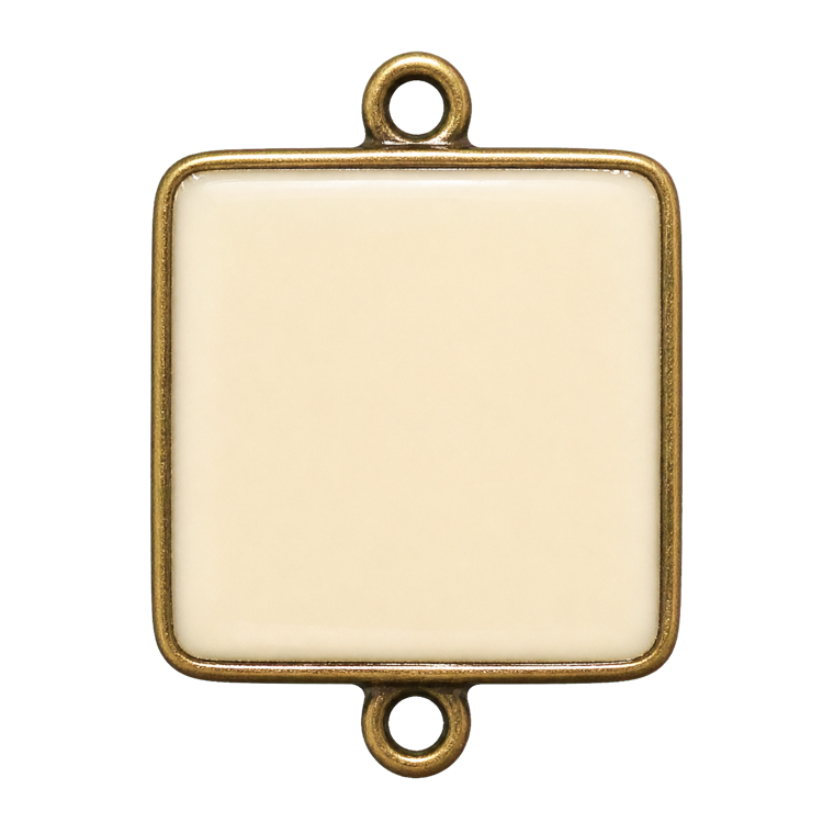 Ivory and brass letter charm used by the string-touch recipe